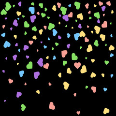 Background from bright multi-colored confetti. Festive heart shaped confetti. Joyful confetti on a black background. Bright colorful background.