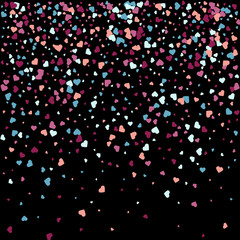 Fototapeta na wymiar Background from bright multi-colored confetti. Festive heart shaped confetti. Joyful confetti on a black background. Bright colorful background.