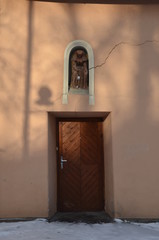 Beautiful sunlight reflect on the wall with silhouette of tree branches.