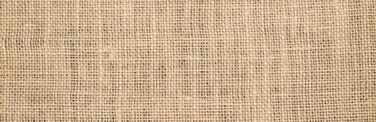 Hessian sackcloth burlap woven texture background/cotton woven fabric background with flecks of varying colors of beige and brown. with copy space. office desk concept. Hessian sackcloth burlap woven.