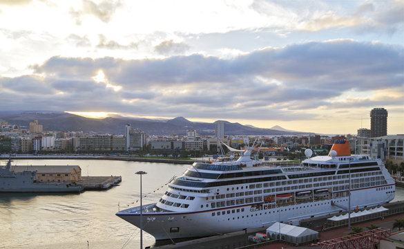 Luxury cruiseship or cruise ship liner in port of Las Palmas on Canary Island of Gran Canaria with panoramic view of skyline and port and island