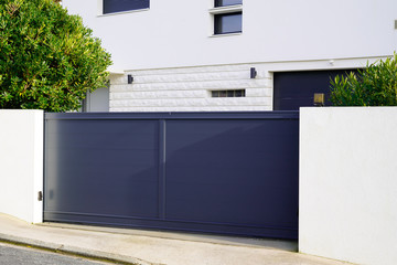 metal gate grey home fence on suburb street house - obrazy, fototapety, plakaty