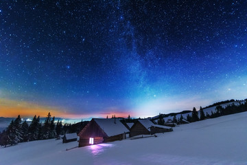 A bright starry night in the mountains with the Milky Way in the sky, Venus and millions of stars...
