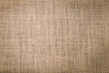 Hessian sackcloth burlap woven texture background/cotton woven fabric background with flecks of varying colors of beige and brown. with copy space. office desk concept. Hessian sackcloth burlap woven.