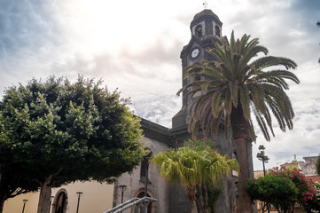 Beautiful image of high clocktower and cathedral in Puerto de la Cruz, Tenerife, Canary islands