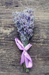 Bunch of lavender flowers on a wooden background