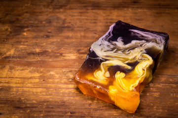Handmade soap on a wooden background close-up