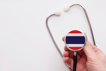 Thailand healthcare concept. Doctor holding a medical stethoscope.