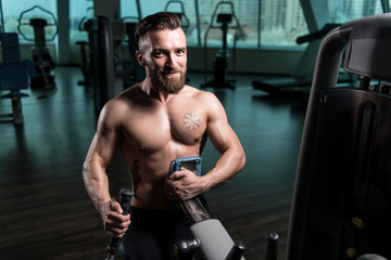 Muscular Man Doing Heavy Weight Exercise For Back