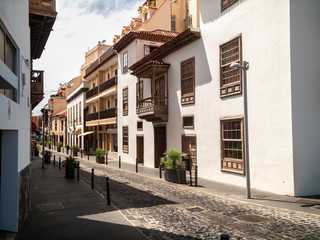 Beautiful old narrow street with cobblestone and building in colonial arhitecture style