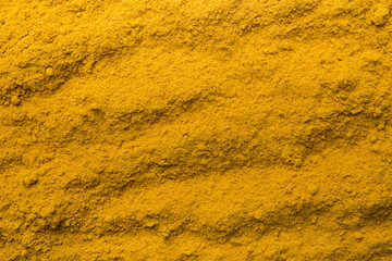 Turmeric powder texture nature background. Herbal asian spices