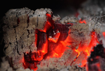 Fire background, red hot glowing charcoals inside stove
