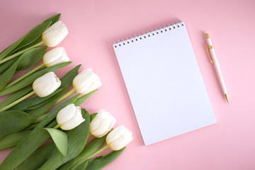 White notebook and tulips