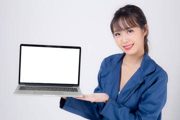 Beautiful young asian business woman happy holding and presenting laptop computer blank screen isolated on white background, businesswoman confident showing notebook empty, advertising concept.