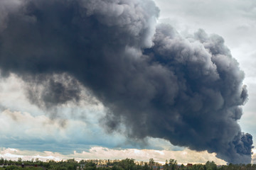 dangerous cloud of black smoke closeup as background.