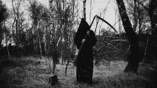 Horror movie scene of the grim reaper in the spooky forest