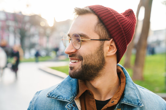 Close up of a handsome young stylish bearded man