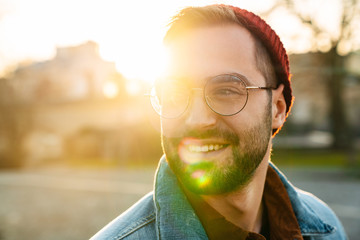 Close up of a handsome young stylish bearded man