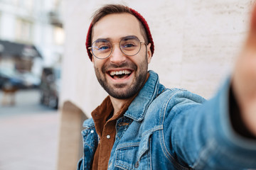 Close up of a handsome young stylish bearded man