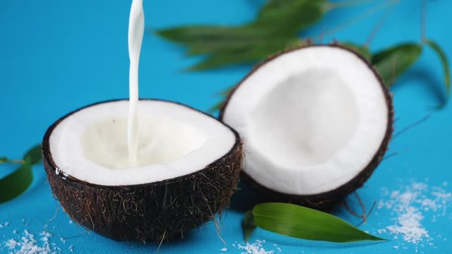 coconut milk pouring in coconut