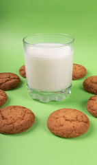 Circle baked biscuits with cup of milk in the middle