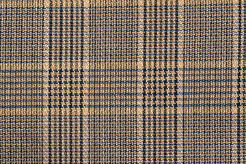 Abstract background. A fragment of a checkered knitwear. Close-up