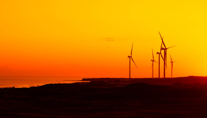 Fototapeta premium wind turbines at sunset