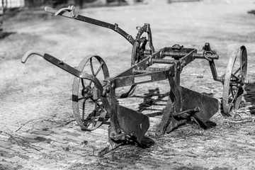 old plough in the sand