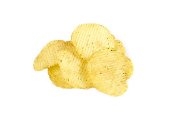 pile of ribbed potato chips isolated on white background
