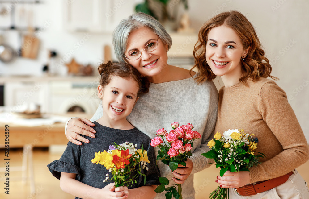 Wall mural mother's day! three generations of family mother, grandmother and daughter congratulate on the holid