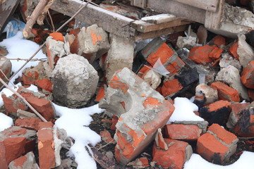Construction waste with elements of and destroyed old structures at municipal landfill