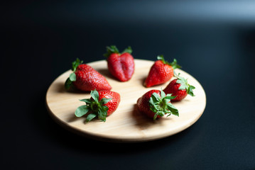 Strawberries on round wood tray