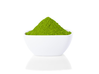 Powder green tea in small bowl on white background