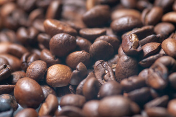 close-up fragrant roasted coffee beans, brown saturated color