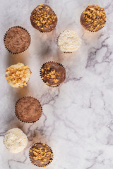 Brigadeiro is a common Brazilian dessert. Delicious chocolate candy Brigadeiro on a table