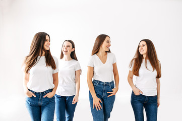 Young positive girls in white blank t-shirts