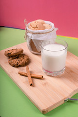 Cup of milk with cinnamon biscuits