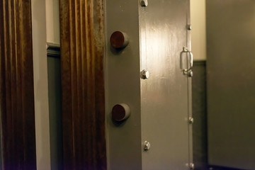Opened old-fashioned solid vault door of a bank.