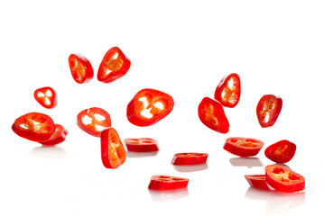 Chili pepper sliced in rings close-up, flying in the air