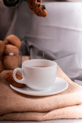 cup of tea and sweet snacks on the table