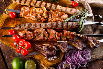 Fresh, homemade beef kebab with vegetables and spices, with barbecue sauce and ketchup