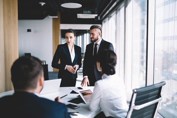 Elegant coworkers meeting on conference in office