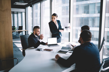 Concentrated colleagues having meeting in office