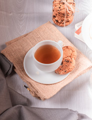 cup of tea and sweet snacks on the table
