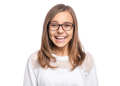 Beautiful caucasian Teen Girl in eyeglasses, isolated on white background. Laughing schoolgirl looking at camera. Happy child with smile - close-up portrait.