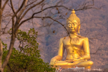 Big Buddha Statue Khao Wongphrachan, Wat Khao Wong Phra Chan temple at top of mountain for thai people and travelers travel visit in Lopburi, Thailand.