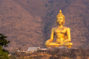 Big Buddha Statue Khao Wongphrachan, Wat Khao Wong Phra Chan temple at top of mountain for thai people and travelers travel visit in Lopburi, Thailand.