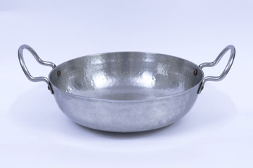 A stainless steel Indian frying pan