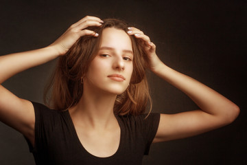 Studio portrait of a girl in a black t-shirt