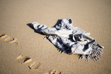 Jacket on the sand. Fermented clothing on the beach.